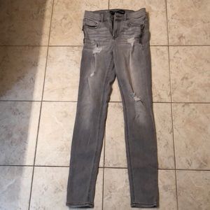 Grey lightly ripped jeans